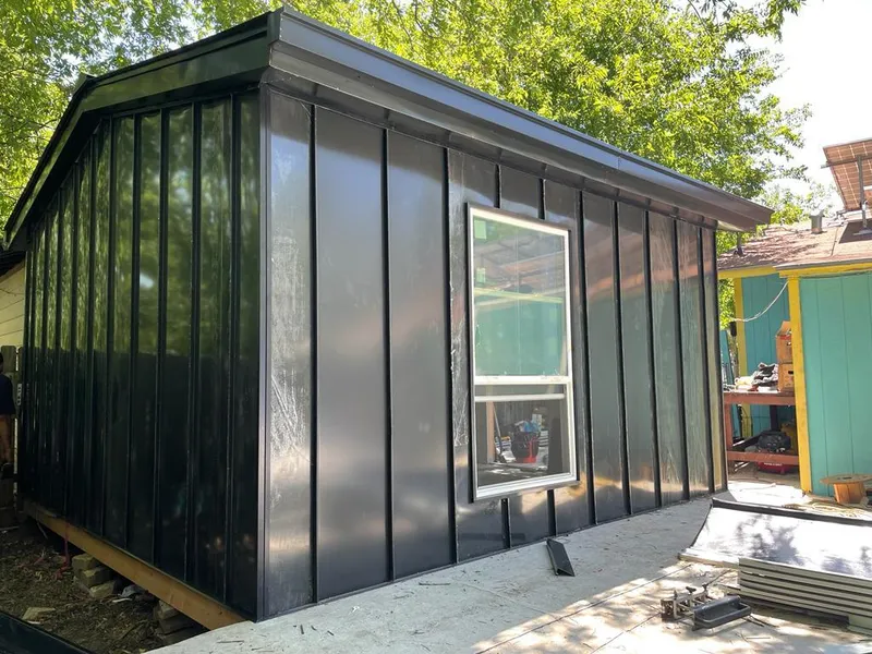 Black standing seam metal wall panels for Roof Inspection in Silsbee