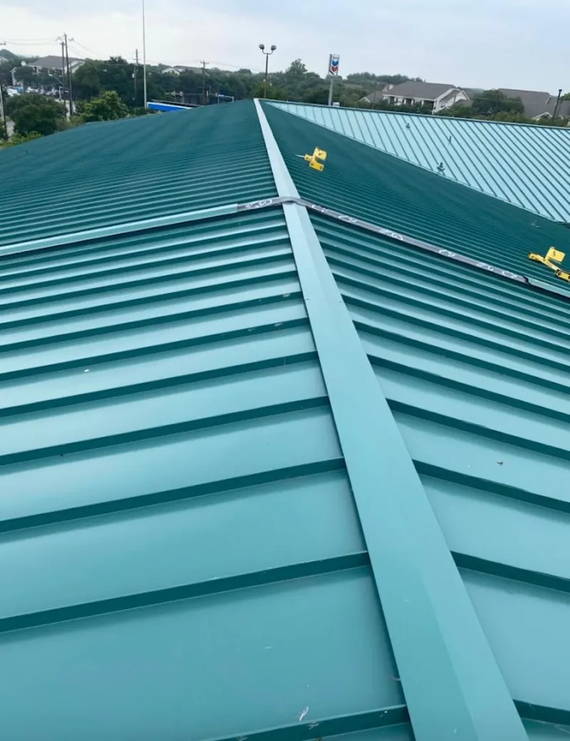 Green commercial metal roof ridge and valley for Metal Roof Repair in Silsbee